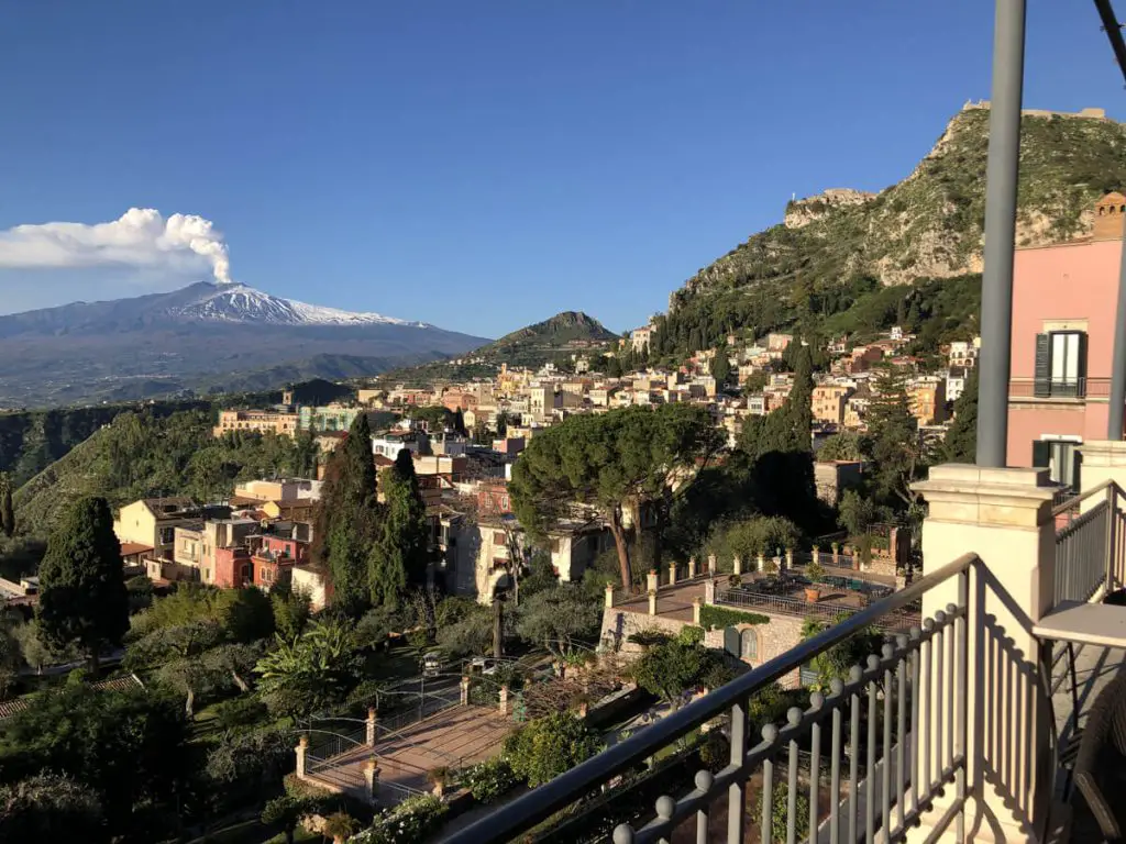 Etna in the distance covered in snow