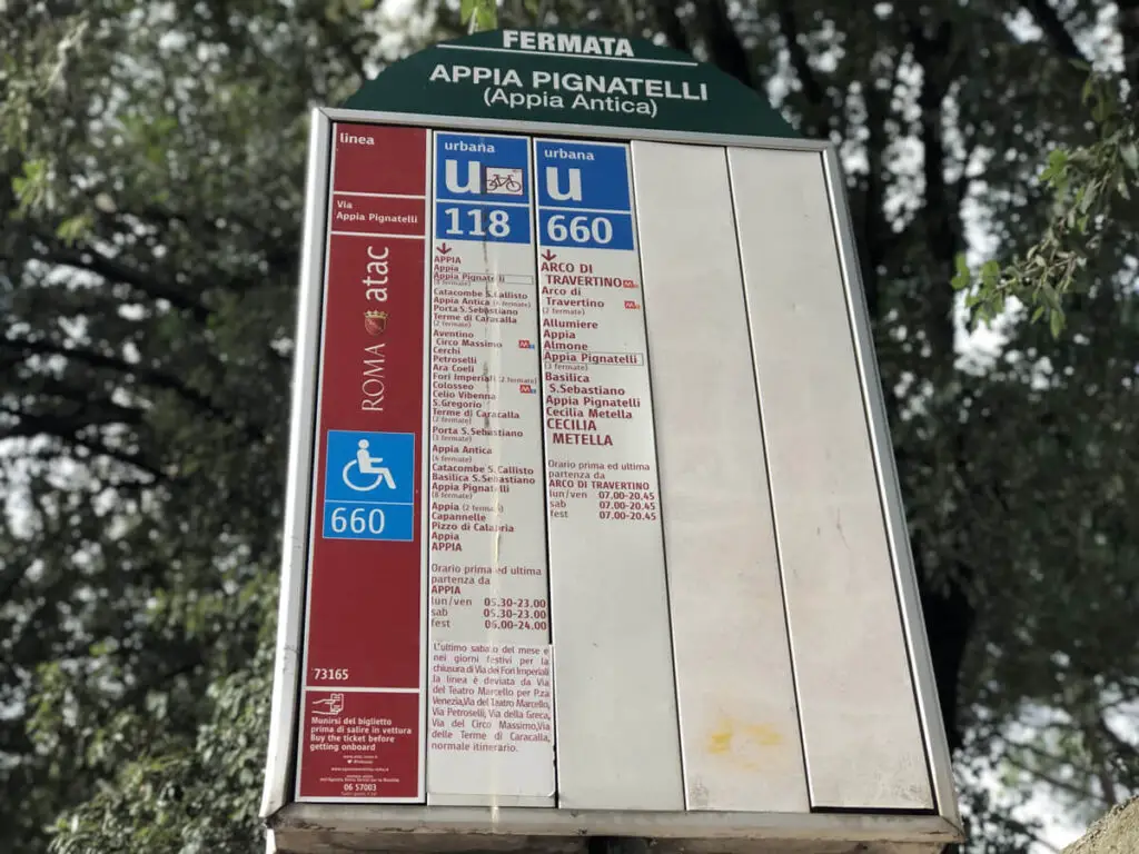 Bus stop sign showing bus routes