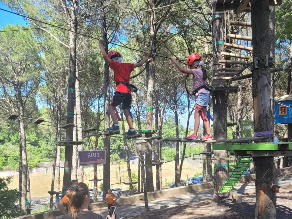 Kids climbing at an adventure park in Sicily