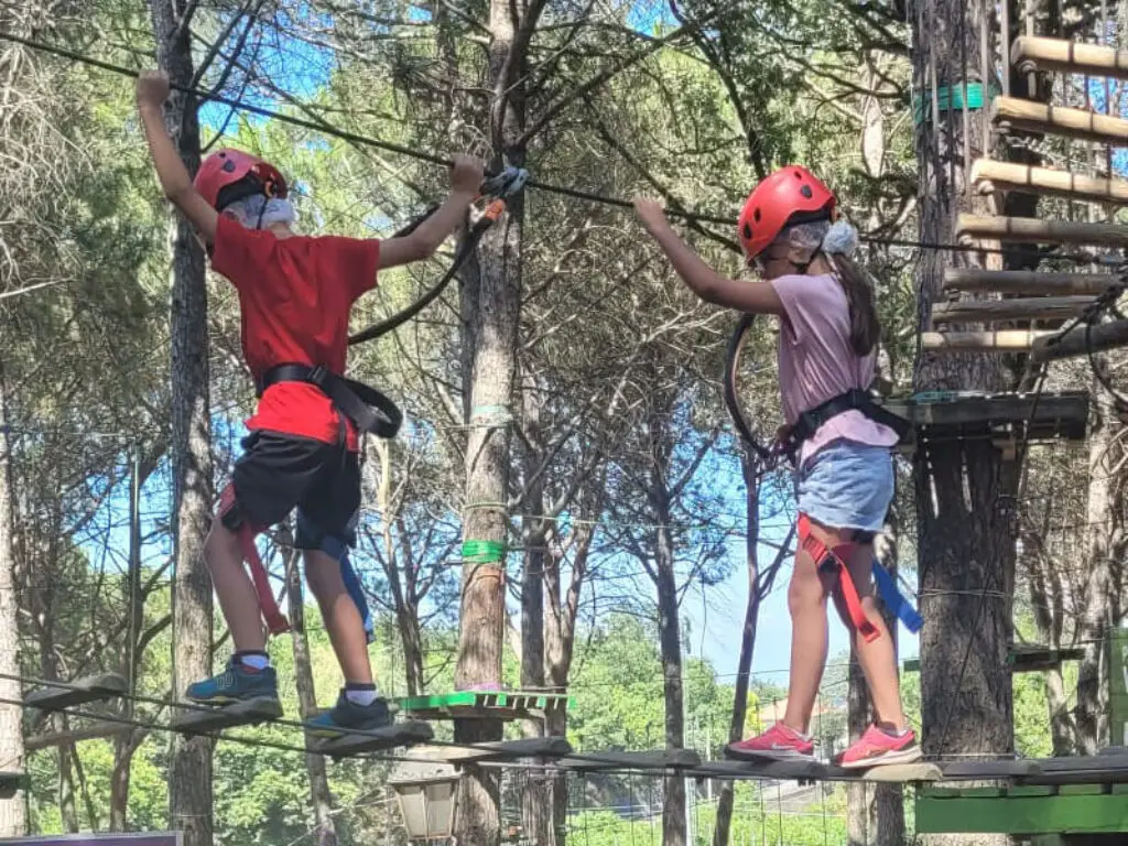 Kids climbing at an adventure park in Sicily